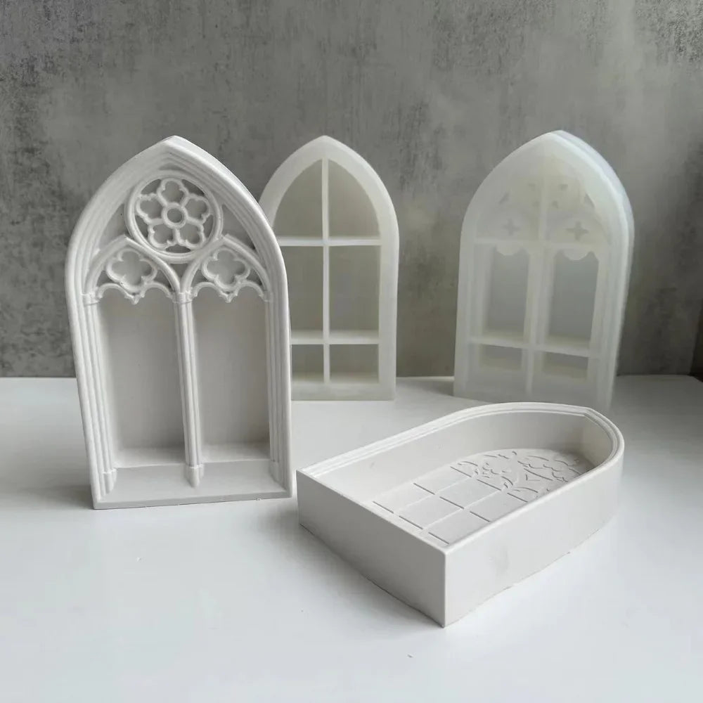 White silicone molds shaped like gothic church windows for crafting resin and plaster