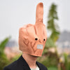 A person wearing a latex finger mask shaped like a middle finger, colored peach or light brown.