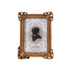 An elegant gold resin photo frame with a vintage European design, featuring a white textured background.