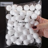 A clear plastic bag filled with white polystyrene foam balls for crafting and decorating.