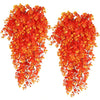 Two strands of bright orange artificial eucalyptus leaves used for home decor