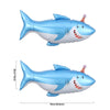 A blue shark foil balloon with a white belly and teeth, shown from the side.