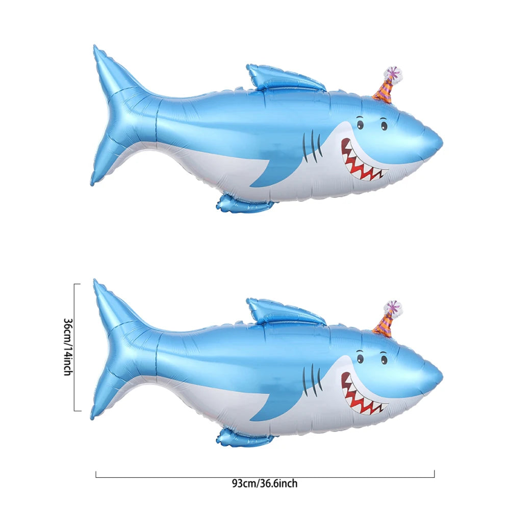 A blue shark foil balloon with a white belly and teeth, shown from the side.