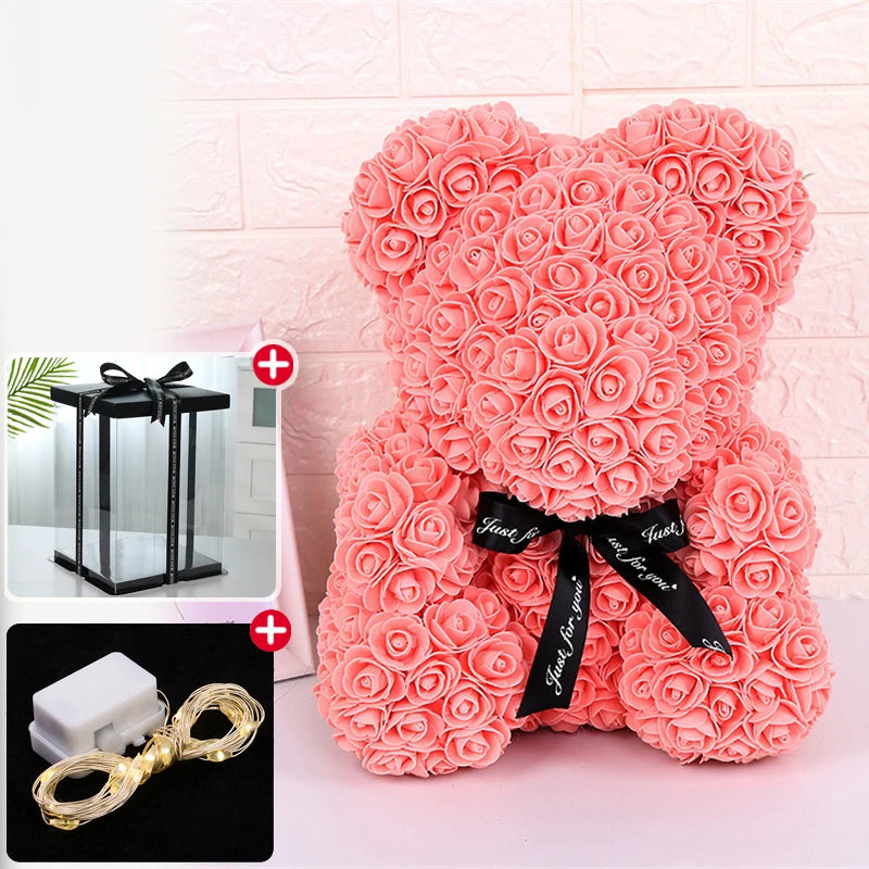 Our fluffy pink rose bear plush toy with a black ribbon and an LED light decoration.