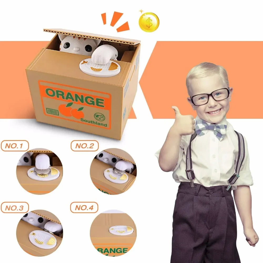 A child is holding an orange cardboard box containing an interactive coin bank with an animal design for kids.