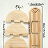 A set of geometric wooden wall shelves made of light wood, featuring arched and rectangular designs.