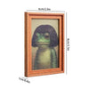 A rectangular wooden photo frame featuring a painted frog with hair styles.