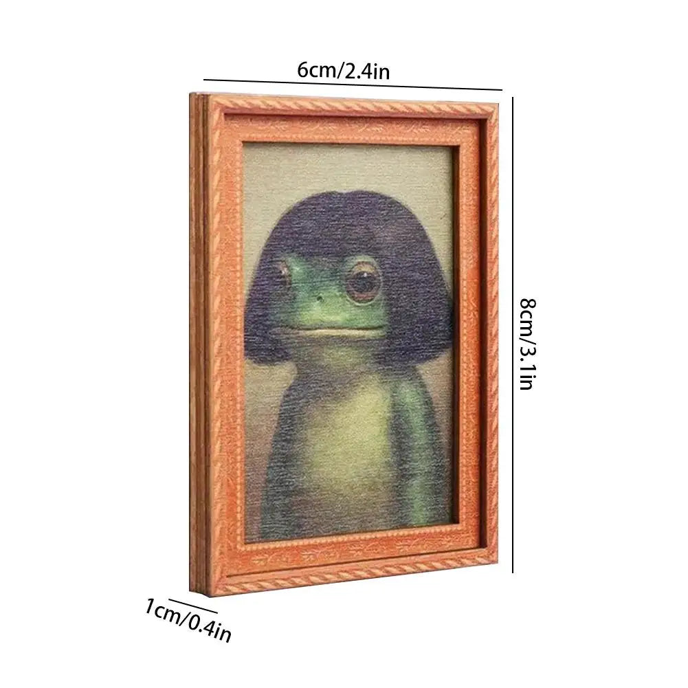 A rectangular wooden photo frame featuring a painted frog with hair styles.