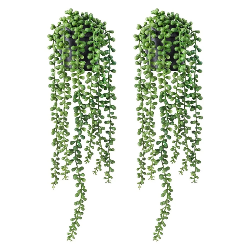 Hanging artificial plant wall decor featuring lush green foliage cascading downwards.
