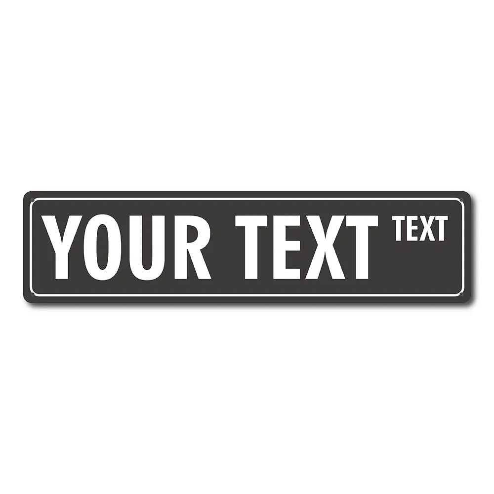 A rectangular black metal street sign with the text YOUR TEXT and a smaller word TEXT.