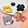 A set of twelve cute animal fridge magnets including a yellow cat, a black cat, and a pink horse.