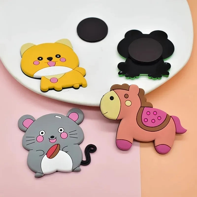 A set of twelve cute animal fridge magnets including a yellow cat, a black cat, and a pink horse.