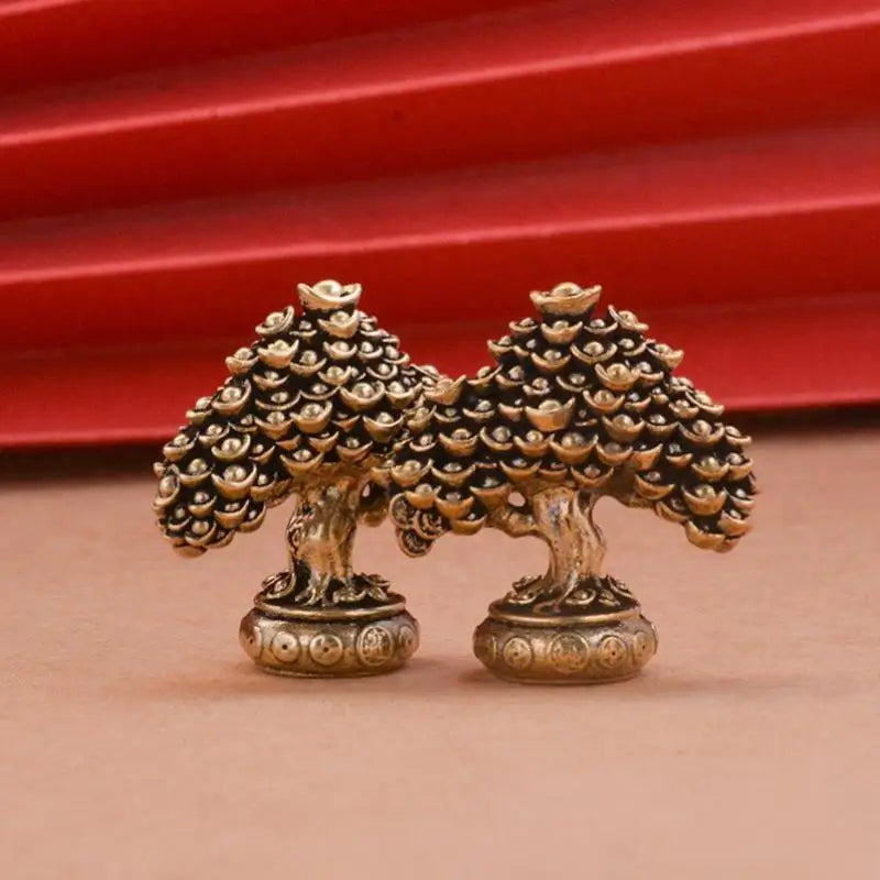 Brass fortune tree ornament featuring pinecone accents and ingot details.