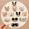 A collection of adjustable butterfly clips in various colors and sizes for clothing
