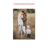 A family portrait featuring a mother, father, and young child standing in tall dry grass.