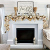 A rustic wreath garland featuring dried leaves and wheat stalks displayed above a fireplace mantel.