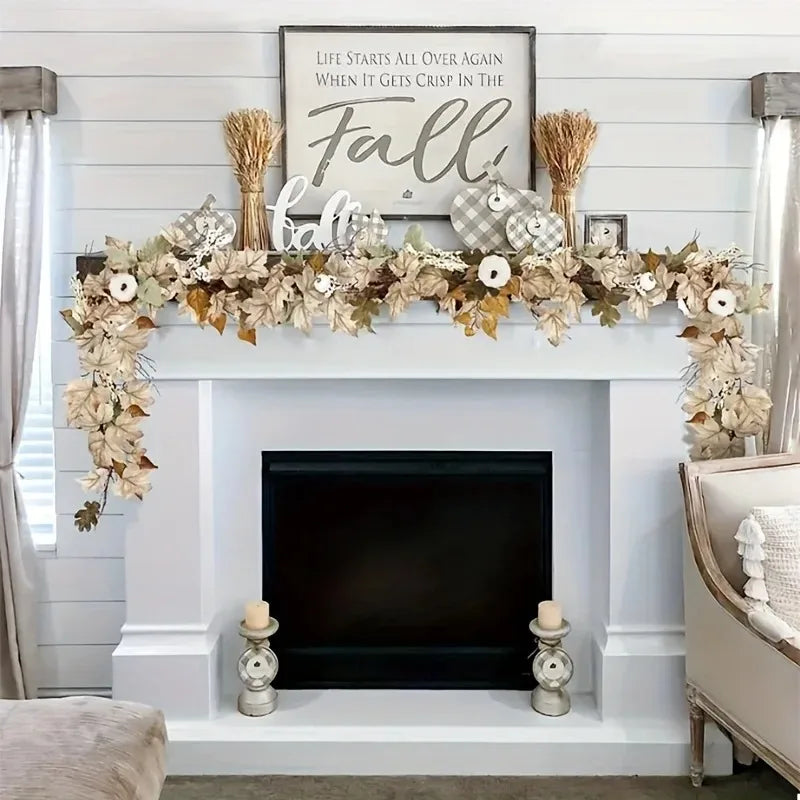 A rustic wreath garland featuring dried leaves and wheat stalks displayed above a fireplace mantel.