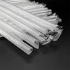 A close-up view of clear plastic drinking straws bundled together.