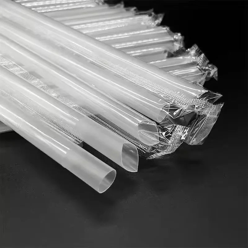 A close-up view of clear plastic drinking straws bundled together.