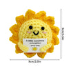 Handmade crochet sun-shaped doll in bright yellow with a pocket for a message