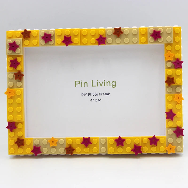 A yellow and brown block photo frame with a square opening, decorated with small star-shaped blocks.