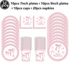 A set of pink disposable party tableware including 7 inch and 9 inch plates, cups, and napkins with bow decorations.