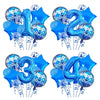 A set of navy and gold foil balloons shaped like the numbers one through four for birthdays