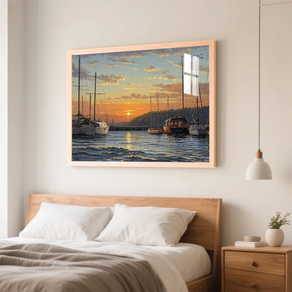 A framed painting of sailboats on water at sunset hanging above a wooden bed.