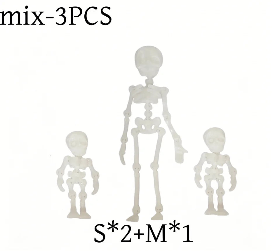 A set of three poseable magnetic skull fridge magnets labeled mix-3PCS