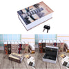 A stack of vintage-style books and a black lock box for valuables.