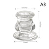 Clear glass candle holder with a decorative candlestick design and round base