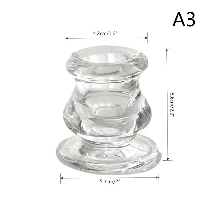 Clear glass candle holder with a decorative candlestick design and round base