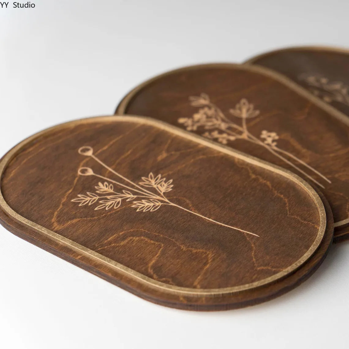 A set of three minimalist wooden flower wall decor pieces with natural wood grain patterns.