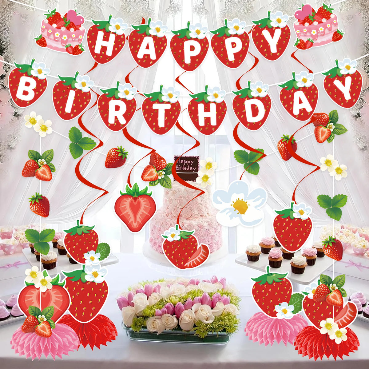 A strawberry theme birthday party decoration set featuring banners, ornaments, and floral accents on a white table.