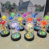A collection of glowing glass vials filled with flowers and light, resembling eternal rose LED night lights.