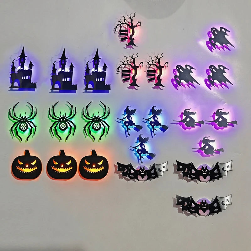 A collection of Halloween 3D wall stickers featuring spooky silhouettes, skulls, spiders, and jack-o'-lanterns with LED night