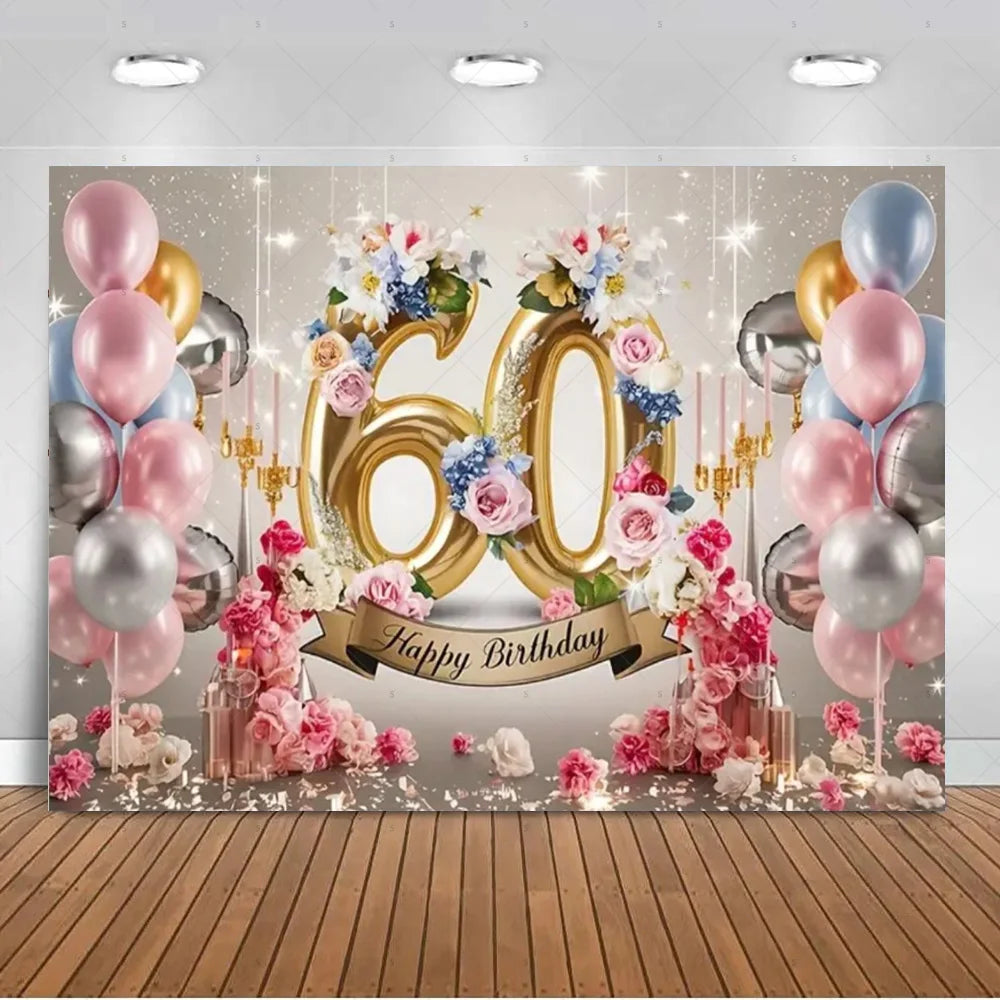 A glamorous balloon backdrop for a 60th birthday featuring gold, silver, and pink balloons and floral decorations.