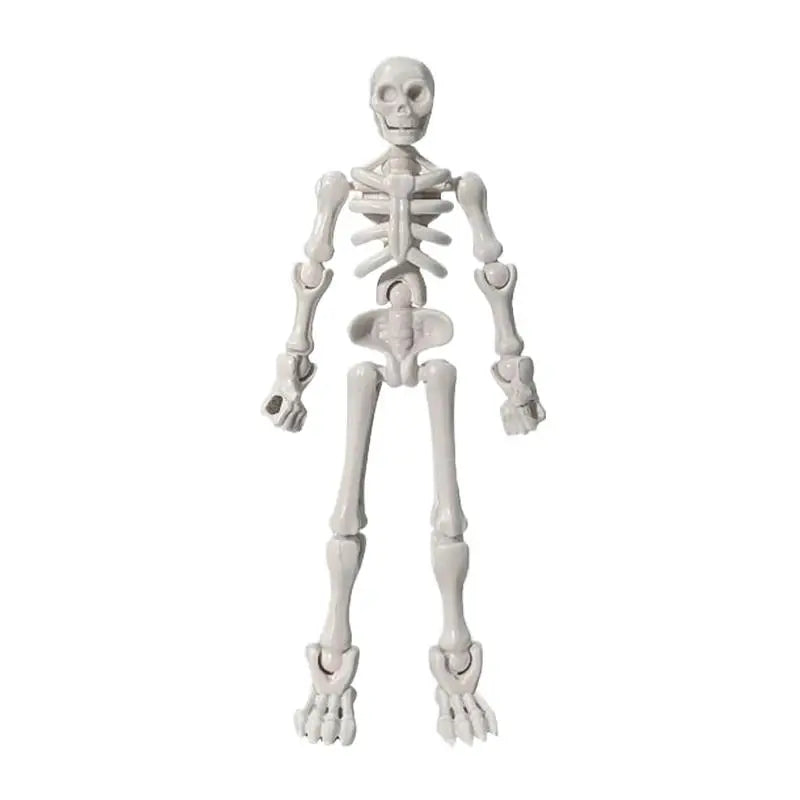 A white plastic skeleton figurine used for craft and decor.