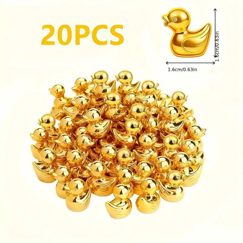 A pile of 20 small golden duck resin statues.