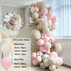 A kit of pink and beige balloons forming a decorative garland arch display.