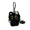 A black seal plush keychain with gold eyes and a silver star charm.