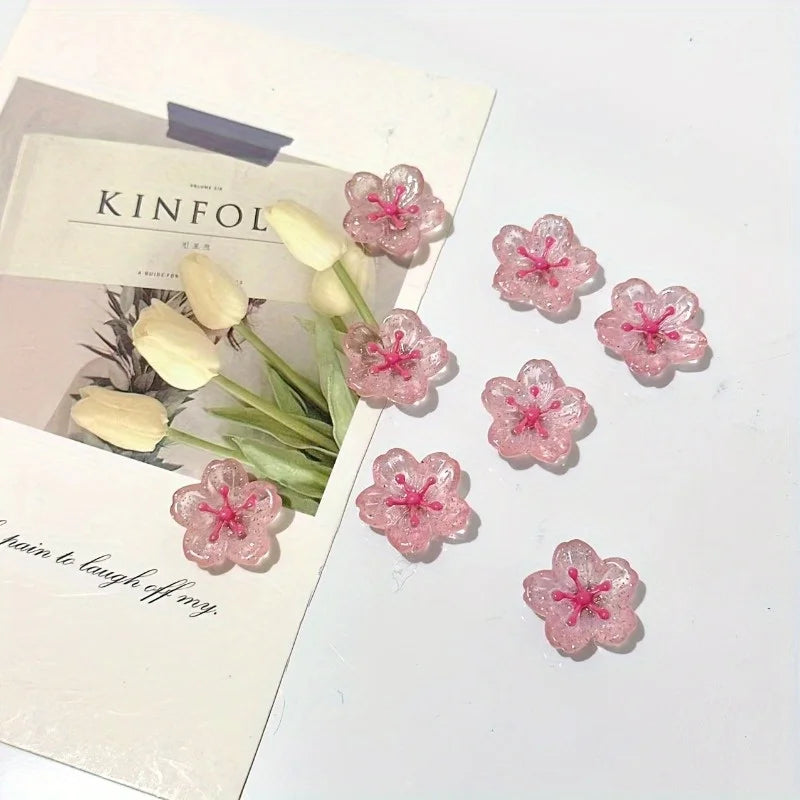 Pink cherry blossom fridge magnets arranged on a white background with elegant typography.