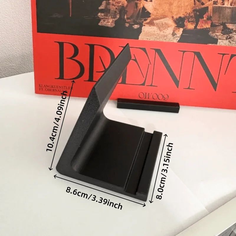 A black minimalist vinyl record and CD display stand is shown next to a red box.