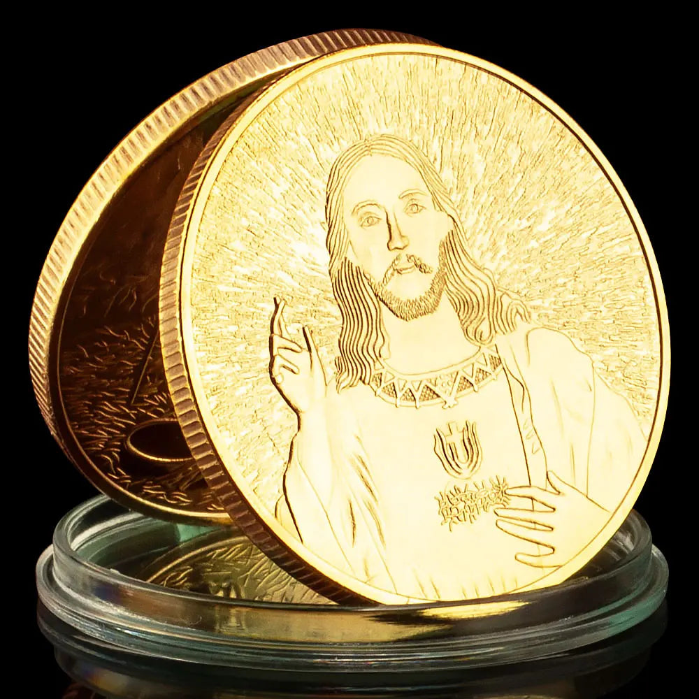 A gold-plated commemorative coin featuring a depiction of Jesus Christ with radiating light.