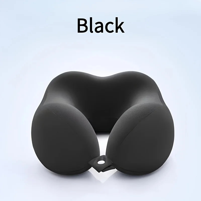 A black U-shaped memory foam neck pillow shown from above.