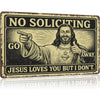 Vintage industrial tin sign featuring a distressed black and white engraving of Jesus with text saying No Soliciting Go Away 