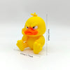 A yellow 3D printed figurine of an angry duck with bright orange facial features.