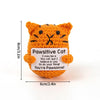 Handmade orange crochet cat doll with black markings and an inspirational slogan tag