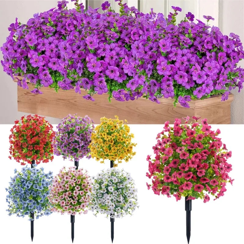 A display of colorful artificial flowers in various shades including purple, pink, red, yellow, and white.