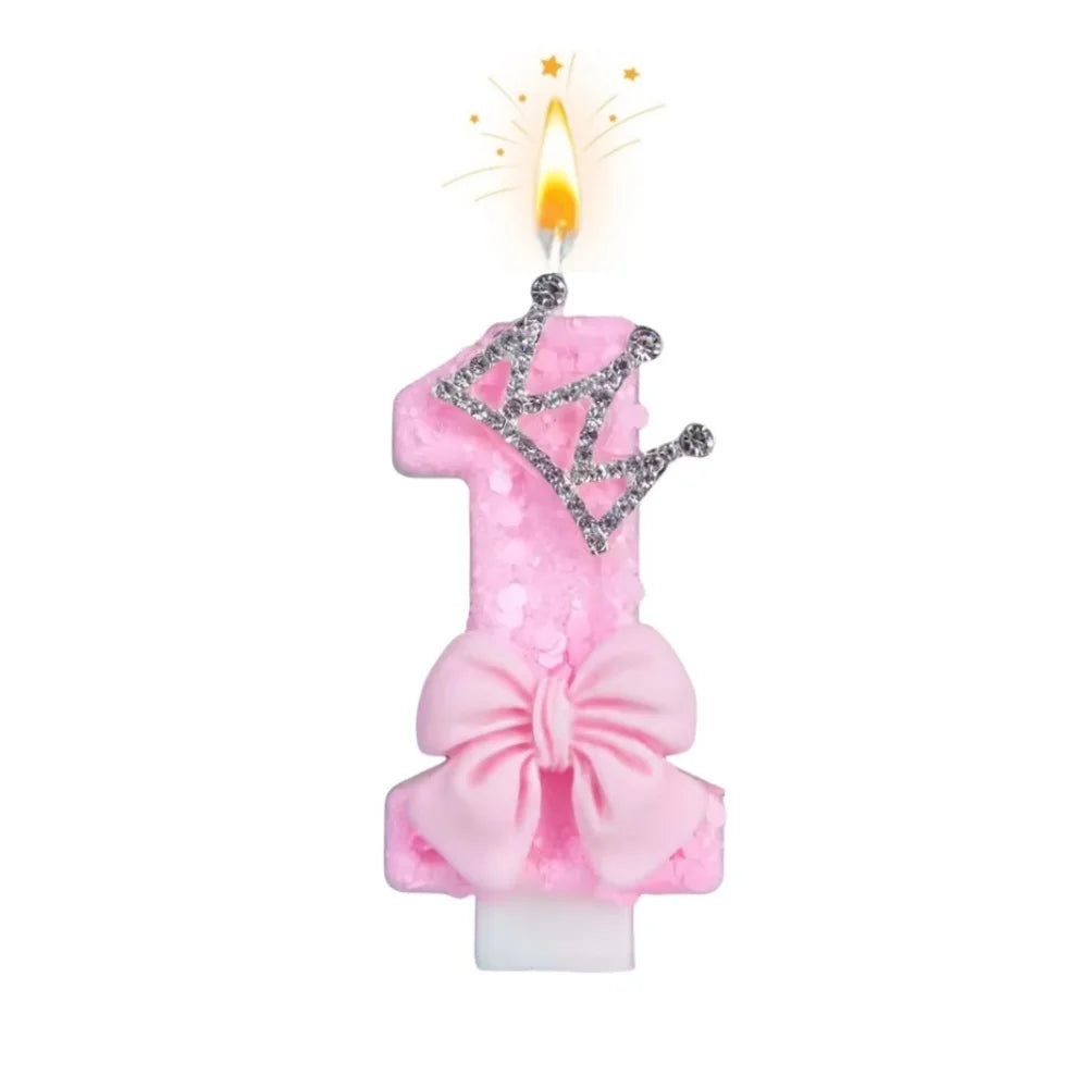 Pink bow crown number birthday candles set with a lit candle and sparkling crown design